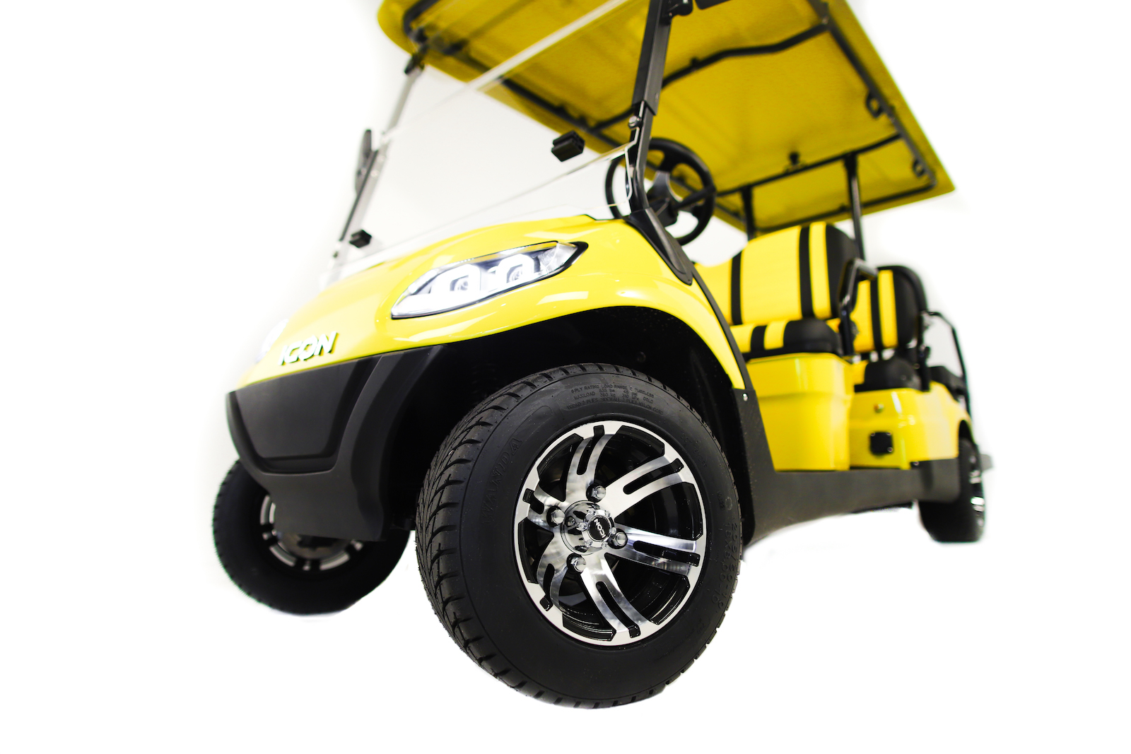 closeup yellow golf cart
