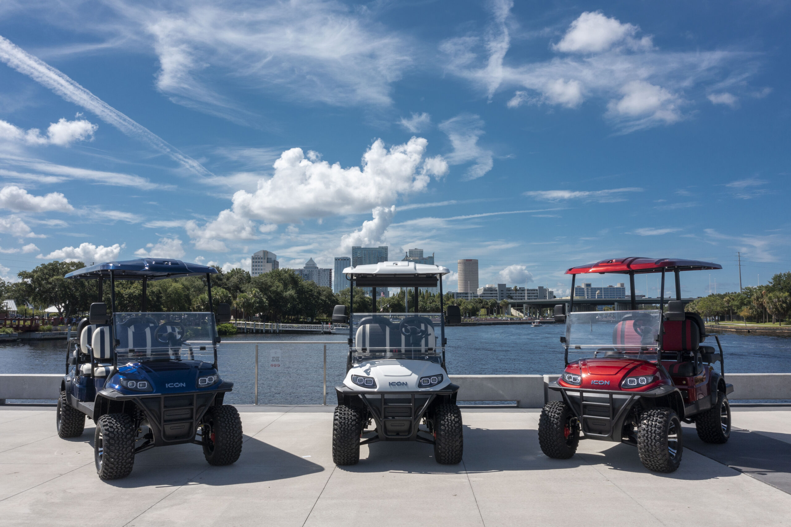 golf carts parked along river